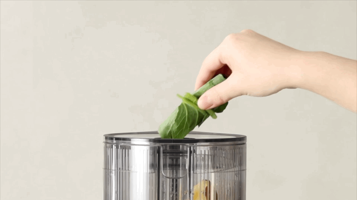 Fresh juice being pressed by the Hurom H80 slow juicer